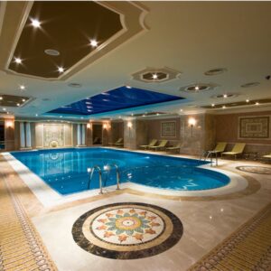 MEC Pools | Marble mosaic pool deck medallion and premium quality glistening glass tile mosaic swimming pool.