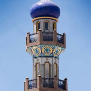 The Minaret of the Sultan Quaboos bin Said’s Al Husin Royal Palace Mosque cladded with royal blue and gold foiled mosaic tiles, custom produced by MEC.