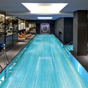 Custom Pool Mosaics by MEC | Lap pool adorned in abstract linear glass tile mosaic.