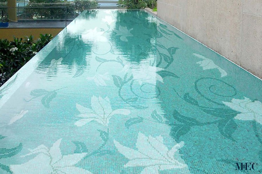 Custom Pools by MEC | Flower and vine scroll glass mosaic tile art.