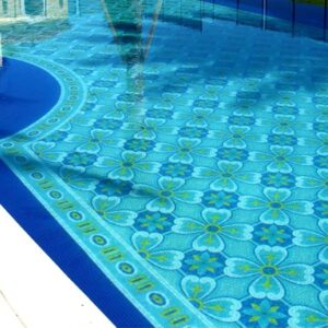 The image is showing a luxurious pattern with seamlessly repeating pattern in yellow, cerulean blue and dark blue glass mosaic tiles by MEC.