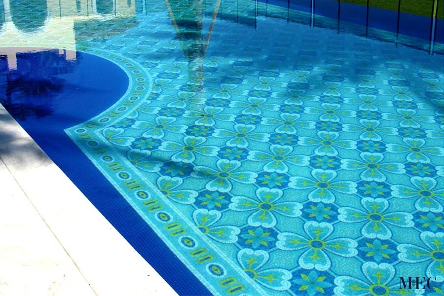 The image is showing a luxurious pattern with seamlessly repeating pattern in yellow, cerulean blue and dark blue glass mosaic tiles by MEC.