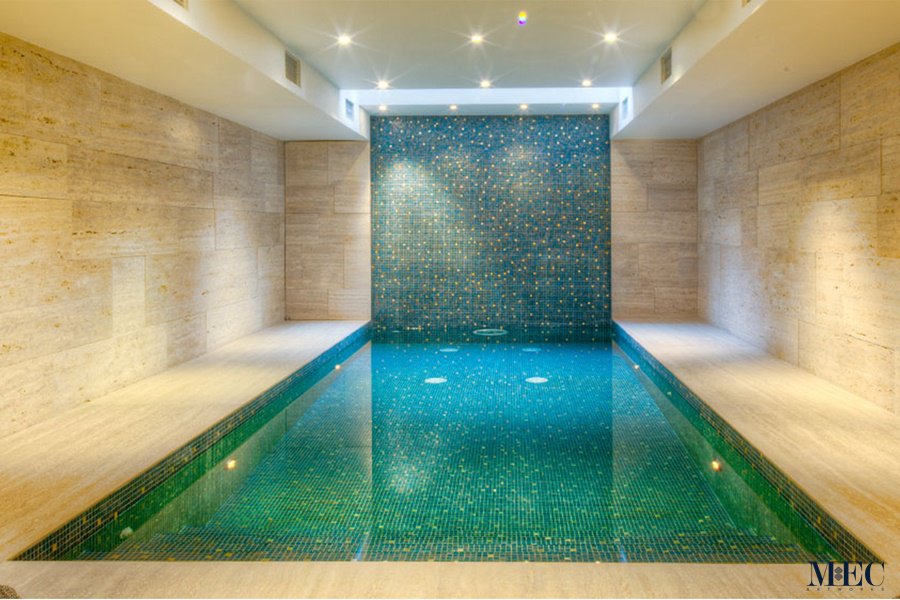 Swimming pool interior and cascade wall cladded with handcrafted mosaic brilliance by MEC.