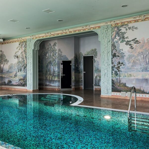 Sea-green, aqua and blue glass mosaic pool designed by MEC