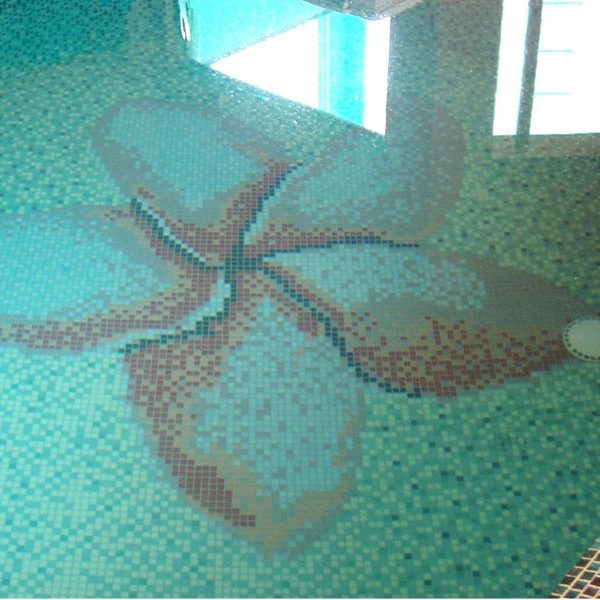 Custom Mosaics by MEC | Plumeria flower pattern with a five petal flower crafted out of glass mosaic for the swimming pool.