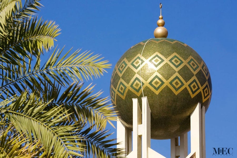 A contemporary Mosque Minaret. Sphere Minaret cladded with green and 24 K gold foiled glass mosaic tiles. Modern Islamic art. Custom handcrafted by MEC.