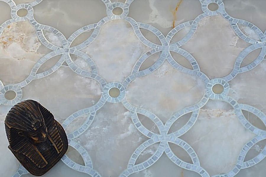 Custom Mosaics by MEC | Handcrafted with marble mosaic, loop and twist splendidly around Water jet cut onyx.