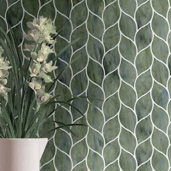 Folha. Product image showing Jade Glass waterjet cut tiles from Lavande collection. Custom leaft shaped green tile design from MEC.