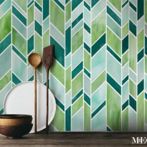 Gallone. Product image showing Jade Glass waterjet cut tiles from Lavande collection. Custom random green chevron tile design from MEC.