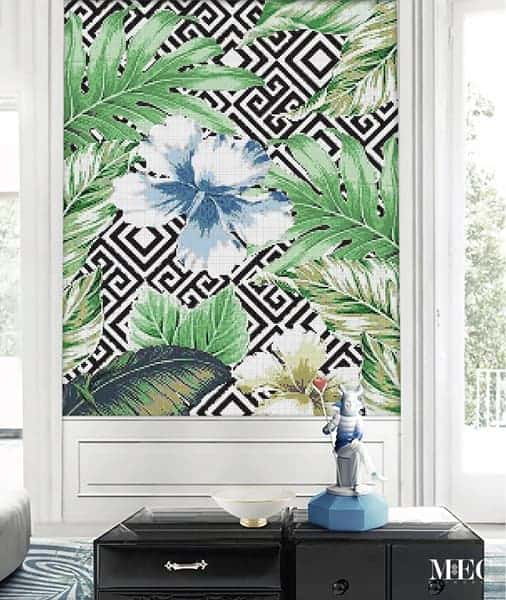 Glass mosaic wall art featuring a hibiscus and tropical leaves against a bold black and white Greek Key background by MEC.