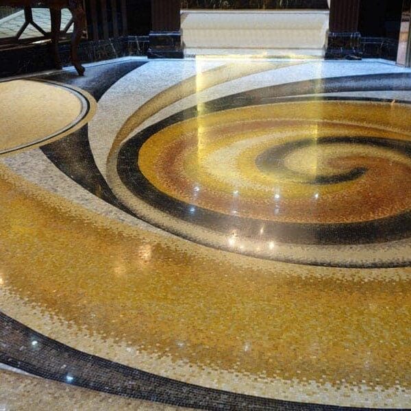 Custom Mosaics by MEC | Handcrafted marble mosaic swirl floor pattern.