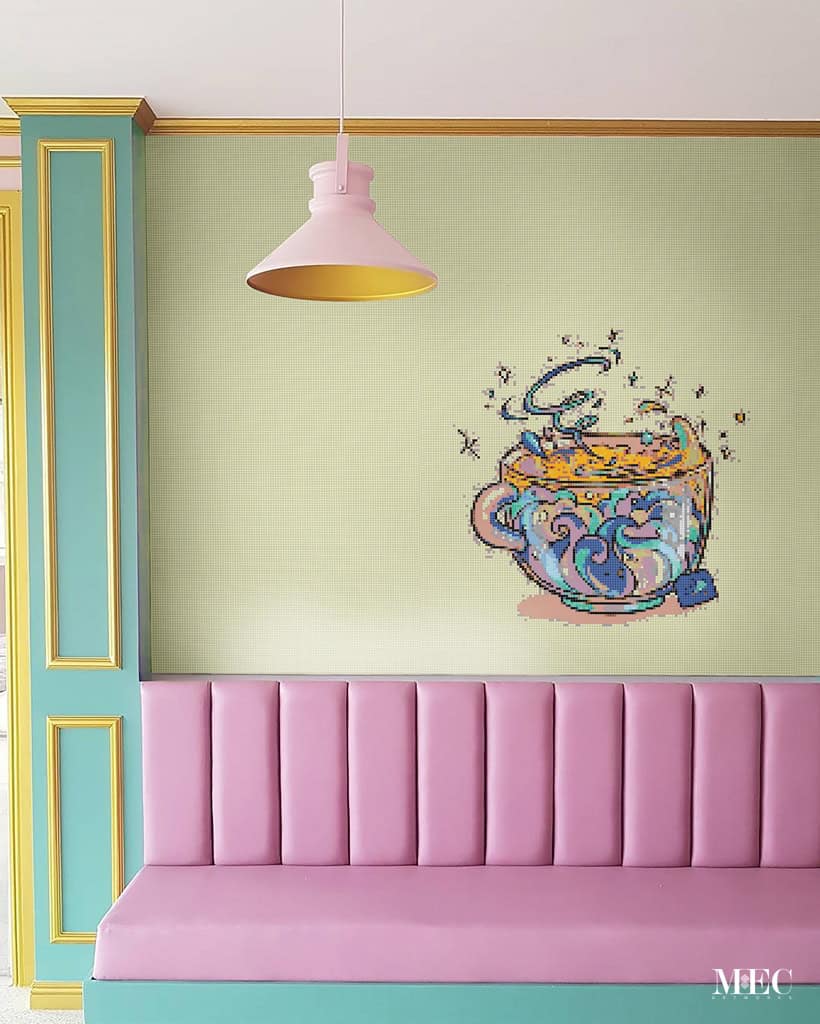 PIXL mosic wall illustration rendered on a pastel pink and green cafe interior 