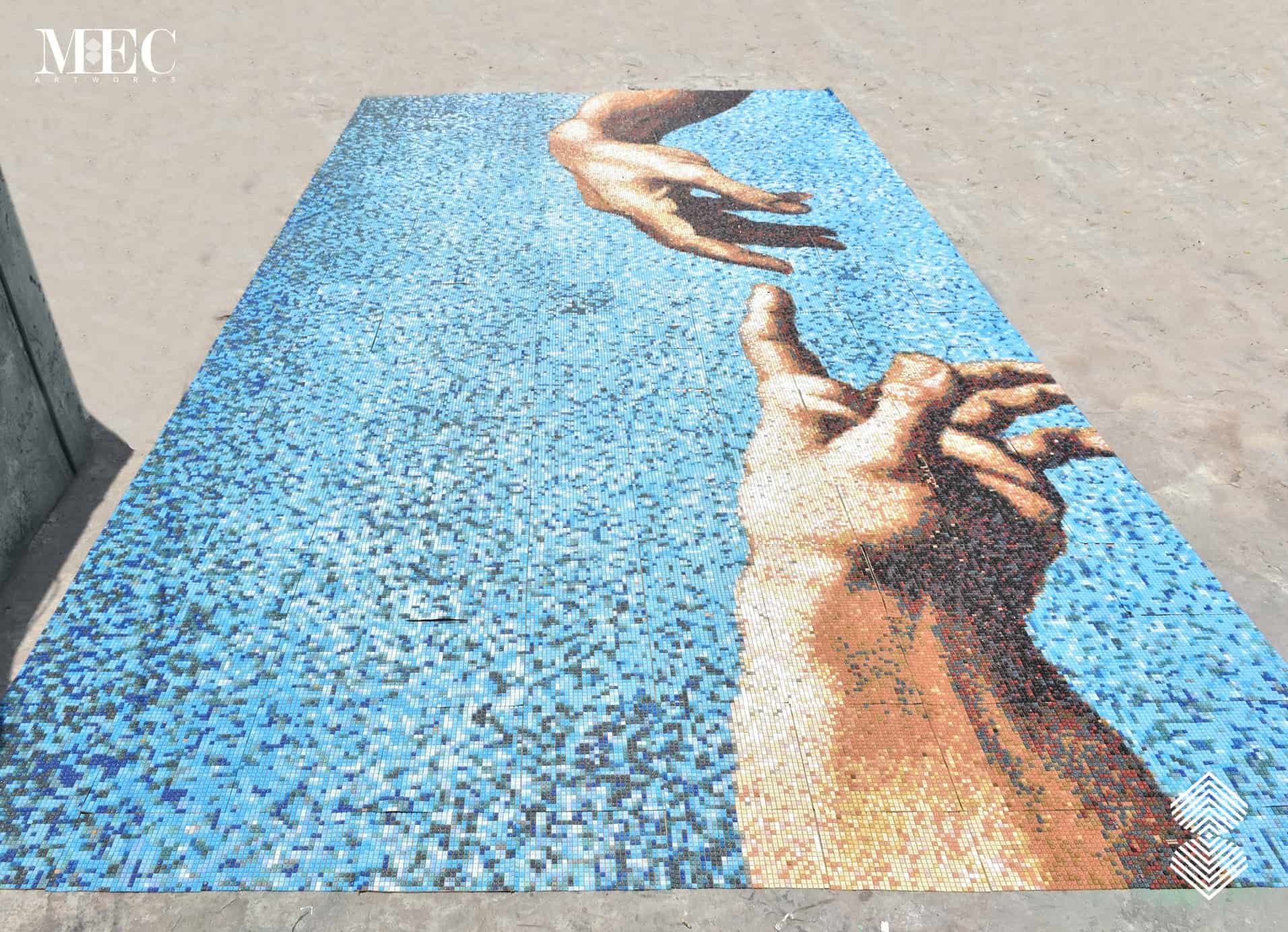 A Vertex glass mosaic rendition of Michelangelo's masterpiece at our workshop (moments before being packed and dispatched). The famous fresco painting from Sistine Chapel's ceiling inspired this swimming pool tile art.
