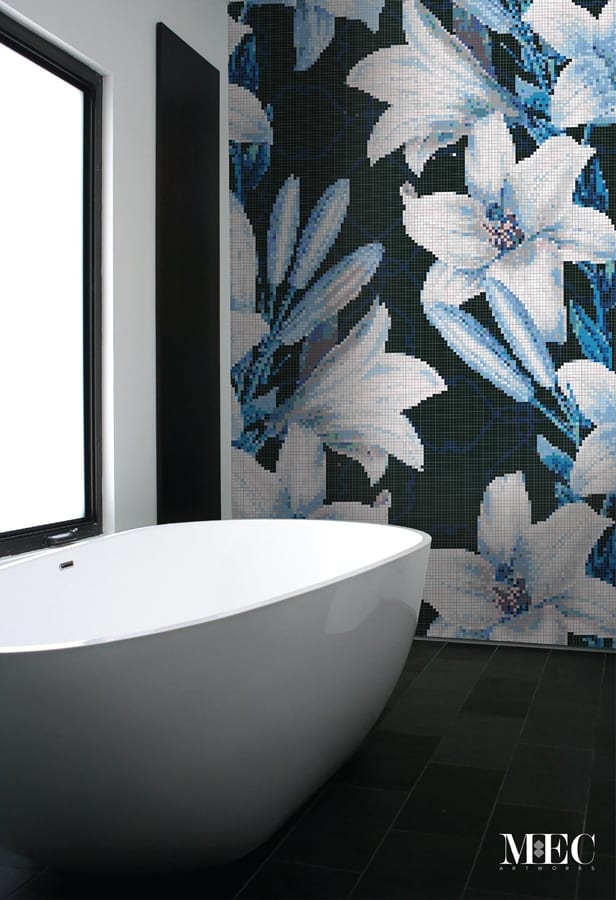 Glass mosaic tile design featuring lilies installed in bathroom wall
