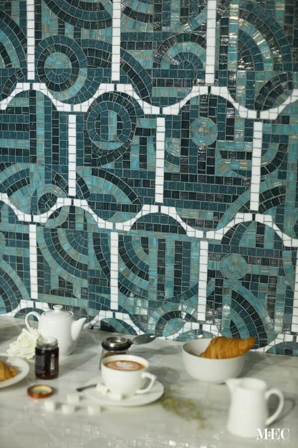 Trullo turquoise and white handmade glass mosaic pattern from Decoratifs catalog by MEC. ombines symmetry of a tile pattern with asymmetry of geometric abstract art
