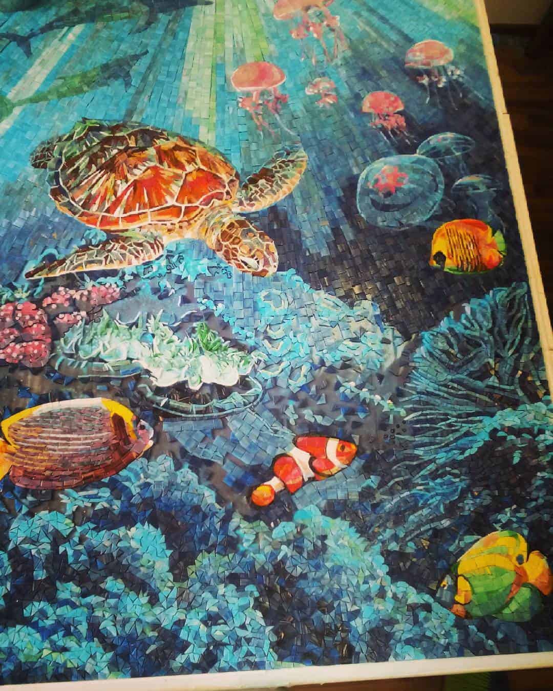 glass mosaic coral reef tropical fish underwater scene with turtle and rays of sunlight