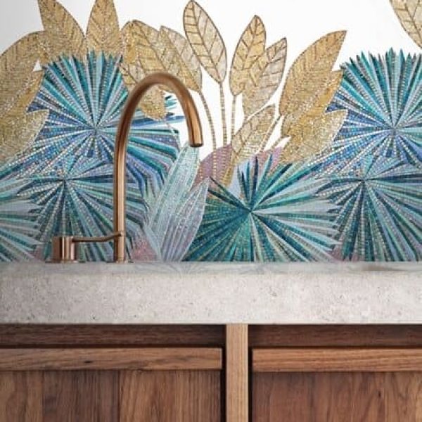 Decorative handcrafted mosaic tile backsplash art featuring copper and green lef patterns