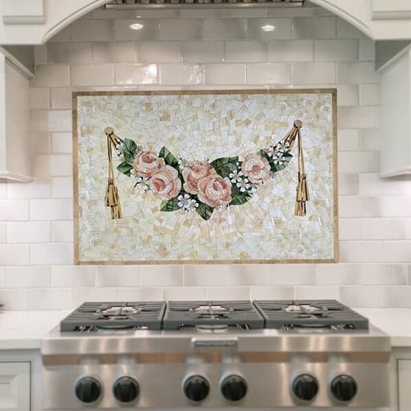 Decorative handcrafted mosaic tile backsplash art featuring rose valance and crushed glass background
