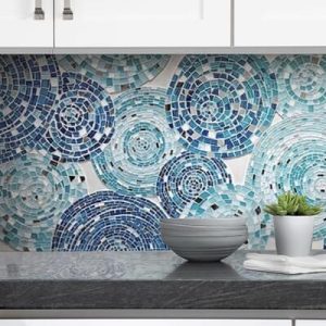 Decorative handcrafted mosaic tile backsplash art featuring whimsical circles in shades of blue