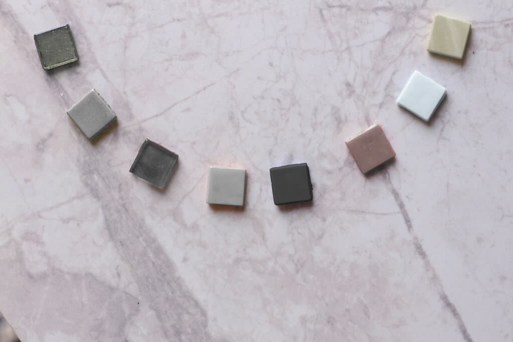 Individual neutral tone Murano glass tiles arranged in an arc