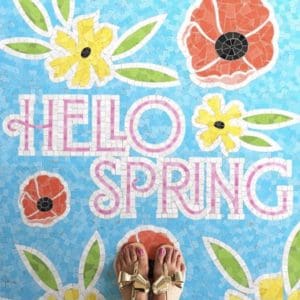 floral mosaic floor design logo with text 'hello spring'