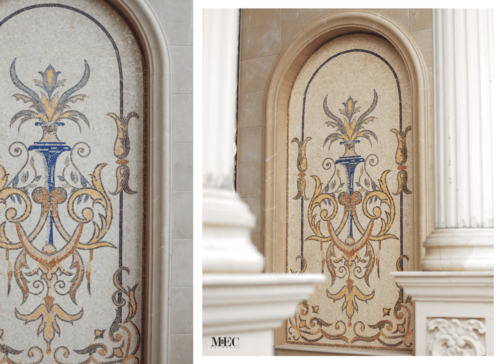 Elegant classical mosaic in arched niche, featuring blue vase and floral patterns in ornate design.