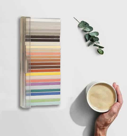 MAPEI grout color shades shown with a cup of coffee and a leafy branch