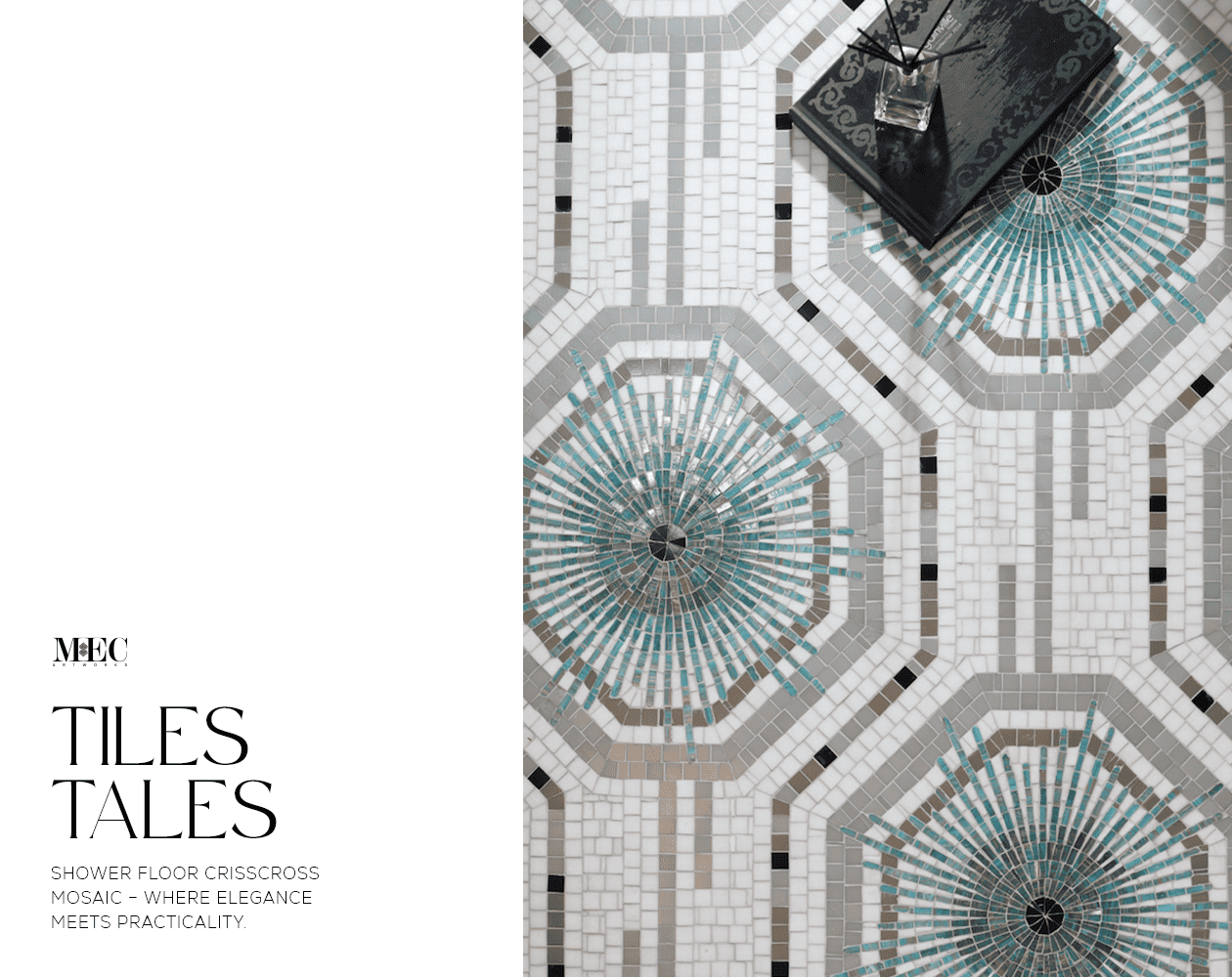 A detailed mosaic shower floor with intricate tile designs and a black table decoratively placed on it.