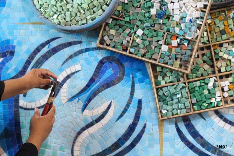 custom pool mosaic making process workshop behind-the-scenes manually cutting glass tiles