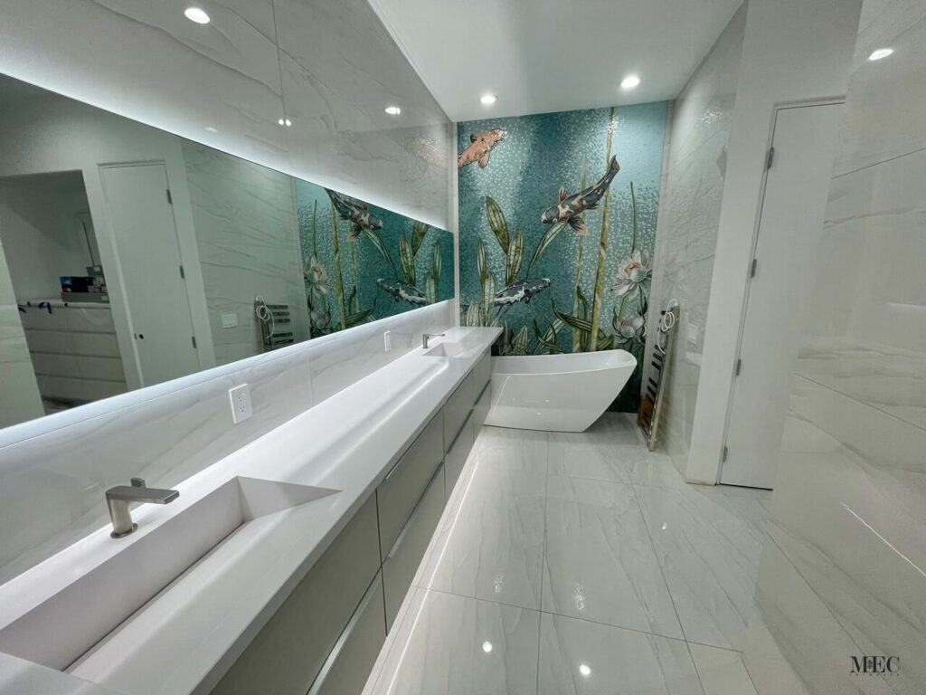 Modern bathroom with sleek white surfaces and a stunning mosaic wall featuring koi fish and aquatic plants.