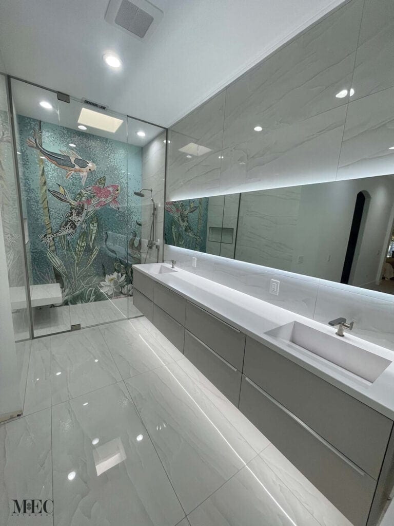 Modern bathroom with sleek double sink vanity and glass shower featuring a vibrant koi fish mosaic mural.