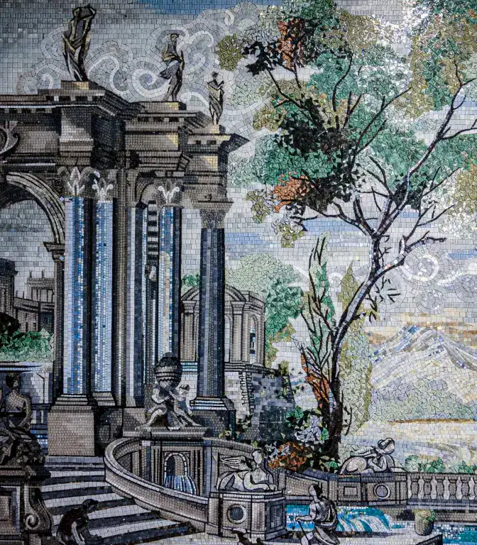 Intricate mosaic artwork depicting classical architecture, statues, and lush trees in a grand courtyard scene.
