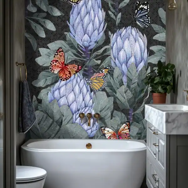 Custom Protea Mosaic Wall Bespoke floral mosaic artwork featuring butterflies and lavender-toned blooms against a dark textured background, installed as a bathroom wall feature.