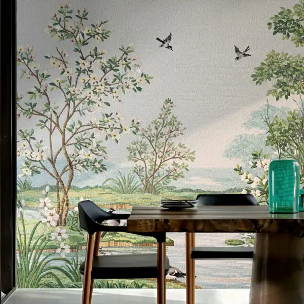 Wall mosaic mural depicting a natural landscape with blossoming trees, green foliage, flying birds, and a serene meadow, crafted with glass mosaic tiles.