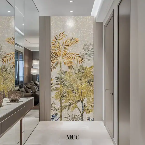 Mosaic wall mural featuring golden palm trees and foliage on a shimmering neutral background, installed as a decorative feature wall in a hallway interior.