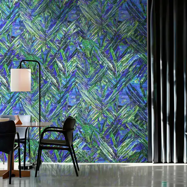 Mosaic wall with layered green and blue leaf patterns, combining abstract lines and textured tiles, creating a vibrant botanical-inspired design.