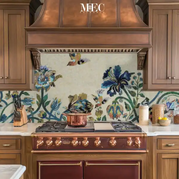 Colorful kitchen backsplash mosaic with large floral motifs and flying birds, handcrafted from glass mosaic tiles in shades of blue, green, gold, and cream.