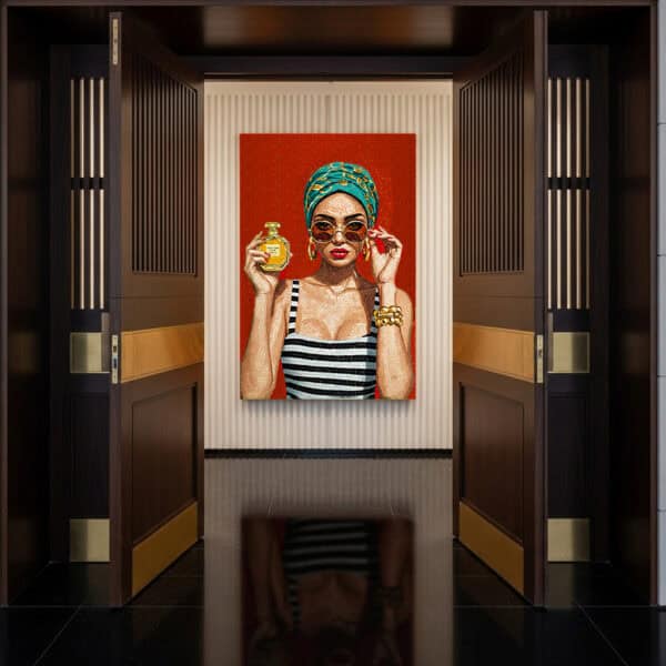 Handmade mosaic portrait mural of a glamorous woman in striped attire with bold accessories, sunglasses, and a perfume bottle, set against a vibrant red background.