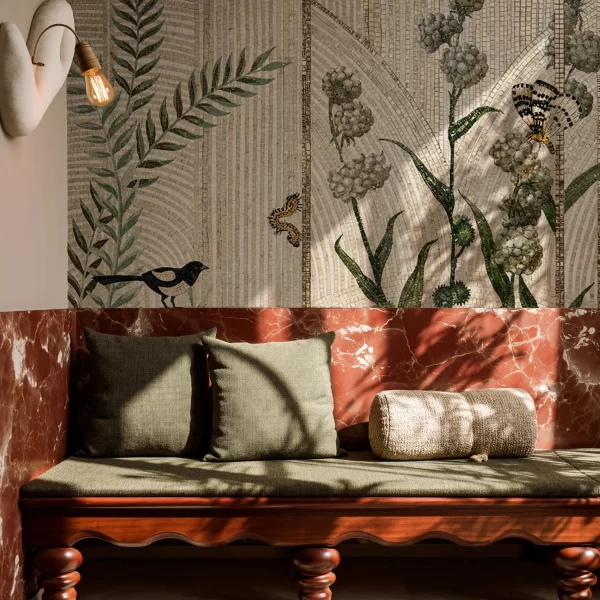 Botanical mosaic wall with arch pattern background, beige tones, green leaves, white flowers, butterfly and bird tile artwork.