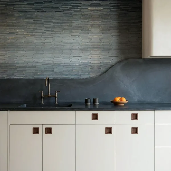 Smoky charcoal ombre mosaic backsplash with slim horizontal mosaic tiles fading from dark grey to light grey, modern kitchen and bathroom wall design.