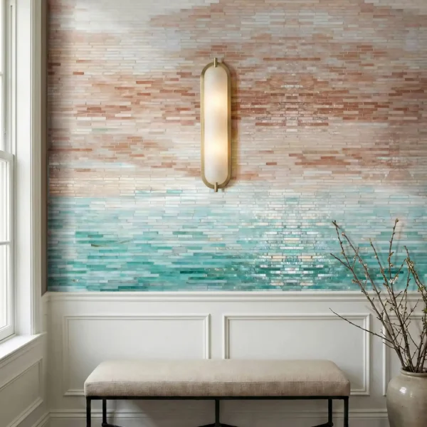 Horizontal stick tile feature wall with ombre gradient from blush and sand to aqua sea-glass tones, modern textured mosaic design.