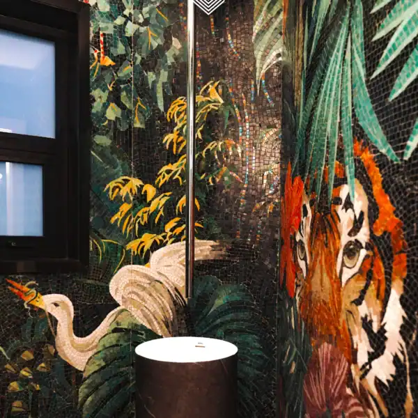 Emerald Jungle Tiger Mosaic Emerald Jungle Tiger mosaic wall with tropical foliage, tiger, and birds in deep green tones for a luxury bathroom feature wall.