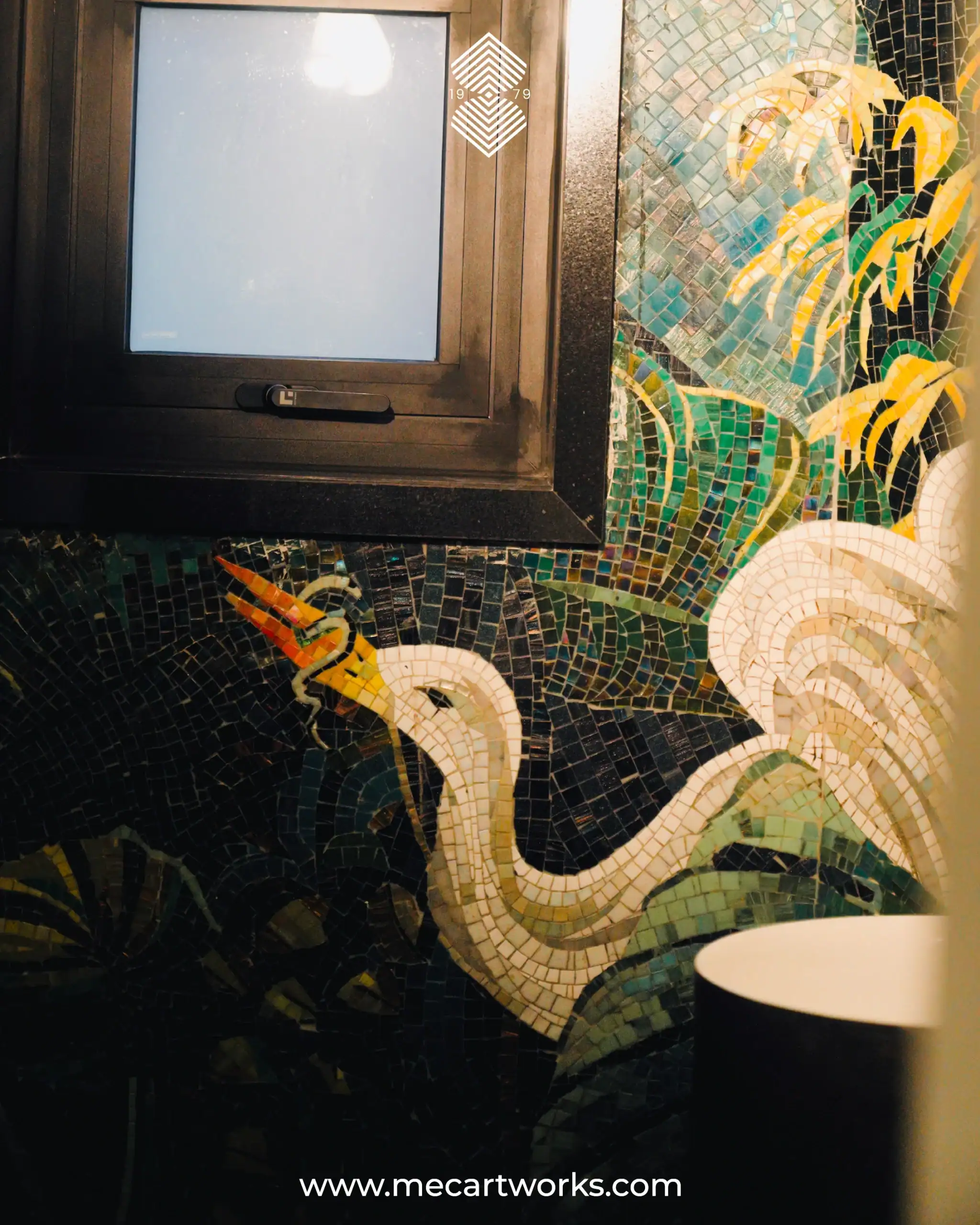 mosaic wall with tropical foliage, and birds in deep green tones for a luxury bathroom feature wall.