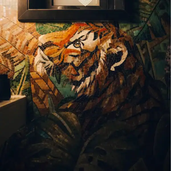 Handcrafted Tiger Mosaic Wall tiger mosaic wall art with jungle foliage, glass and stone tiles in orange, green and earthy tones, ideal for luxury interiors and feature walls