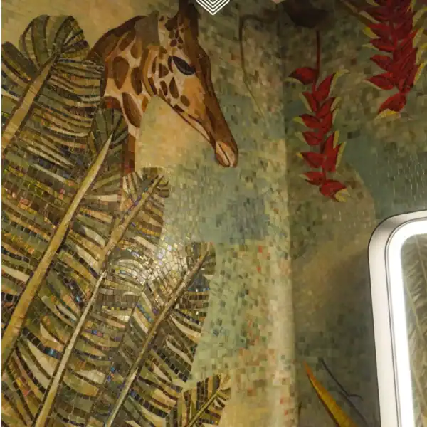 Sunlit Canopy Giraffe Mosaic Giraffe jungle mosaic wall with tropical leaves and warm green tones for luxury bathroom or feature wall design.