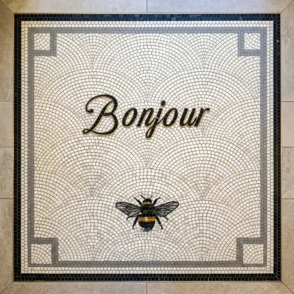 Bonjour Bee Mosaic Panel bonjour mosaic with elegant script and bee motif on ivory stone background, ideal for entryways, cafes, luxury interiors, and decorative floor designs