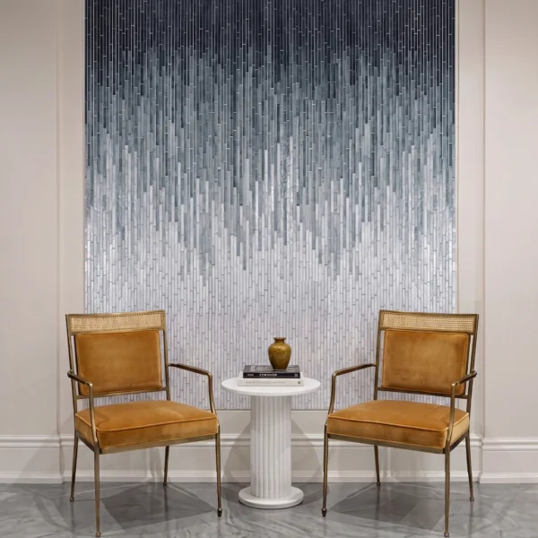 Falling Mist Ombre Glass Mosaic vertical gradient glass mosaic feature wall in charcoal gray and white tones behind modern seating area in luxury interior