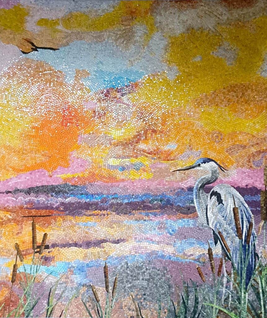 luxury sunset mosaic mural featuring a graceful heron by a lakeside with handcrafted swirling tesserae in warm pastel tones