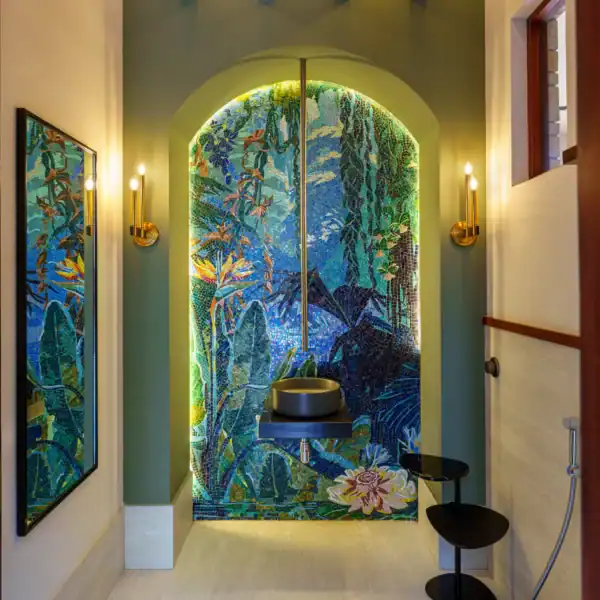 Tropical Oasis Bathroom Mosaic Wall tropical mosaic mural with lush leaves and blue water tones in luxury bathroom, ideal for spa interiors and statement feature walls