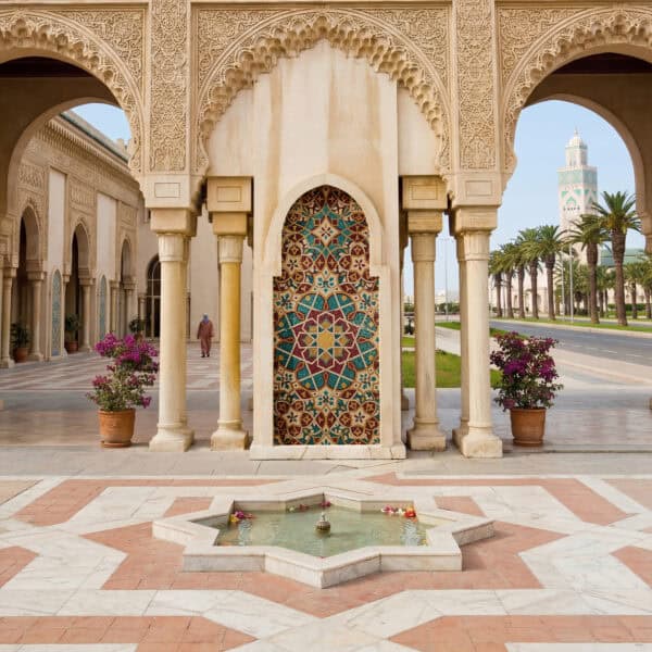 Imperial Courtyard Mosaic luxury moroccan mosaic fountain with geometric star patterns colorful islamic motifs and elegant courtyard architectural design